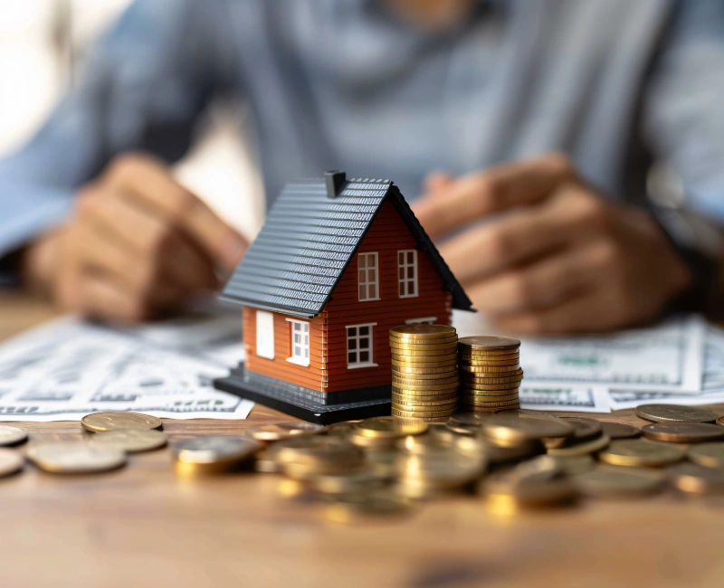 Homeowner reviewing budget documents and cost estimates for a home addition project in Mississauga